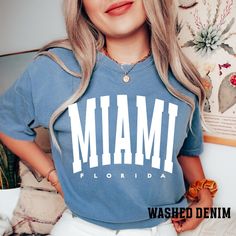 "Comfort Colors Miami shirt, Miami Sweatshirt, vintage Miami Sweatshirt, Retro Miami Gift, College Student shirt, Miami fan shirt -Please check Color and Size Charts before placing the order. You can find them in the listing's photos (Depending on what device you are viewing this listing colors may vary slightly). -Returns and exchanges are accepted only if there are defects \"No Extra Costs\" We create custom t-shirts with great designs for everyone's liking. If you don't find the size or color you would like, please message us and we will be happy to  accommodate! Comfort Colors Miami shirt, Miami Sweatshirt, vintage Miami Sweatshirt, Retro Miami Gift, College Student shirt, Miami fan shirt PRODUCT T-shirt Comfort Colors® 1717     Medium fabric (6.1 oz/yd² (206.8 g/m     Relaxed fit Miami Sweatshirt, Retro Miami, Miami Shirt, Vintage Miami, Student Shirt, Sweatshirt Vintage, Fan Shirts, College Student, Custom T Shirts