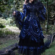 An item that will make you look like a mysterious and elegant young lady. A gothic blouse richly decorated with black lace embroidery, a tiered skirt that captivates the eye with its elegant volume, and an embroidered fishtail skirt with different lengths at the front and back. Like an aristocratic lady from medieval Europe. 
 
 

 

 
 
 Item 
 
 Blouse (navy) 
 Tiered skirt (navy) 
 Fishtail skirt (black) 
 
 
 Size 
 
 Blouse 
 
 XS size 
 
 Length (front): 59cm 
 Length (back): 73cm 
 Should Gothic Long Sleeve Halloween Vintage Dress, Gothic Long Sleeve Vintage Dress For Halloween, Halloween Gothic Long Sleeve Vintage Dress, Victorian Long Sleeve Party Dress, Gothic Long Sleeve Vintage Dress For Costume, Victorian Ruffled Dress For Halloween Costume Party, Halloween Victorian Dress With Ruffles For Costume Party, Victorian Dress With Ruffles For Halloween Wedding, Gothic Fitted Vintage Dress For Costume Party