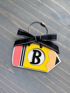 This is the perfect addition to your teacher bag. It can also be used as: -Car Charm -Christmas stocking personalized tag -Great as a ornament for your Christmas tree Details: -It's a 3D wood baseball or softball tag with ribbon and a carabiner for easy attachment. -Approximately 4 inches -Personalize it with your kids name -Laser cut 1/4 wood, painted and sealed with a protective clear coating that prevents chipping, peeling or fading. -Ribbon can be different than the one pictured. *RETURNS/EX Educational Back To School Craft Supplies Gift, Customizable Educational Craft Supplies For Gifts, Personalized Cute Craft Supplies For Teacher Appreciation, Personalized Rectangular Craft Supplies For Gifts, Teacher Bag, Bogg Bag, Teacher Bags, Bag Tag, Car Charms