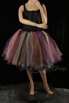 "The perfect tulle skirt for halloween! Makes for the perfect festive witch. Our tutus are made in adult sizes made in XS to Plus size. This tutu skirt is fuller then our normal knee length tutus. This skirt is handmade from two layers of 200yards worth of 6\" strips of tulle in purple, orange, apple and black Bridal tulle. All tulle is tightly machine gathered, sewn and sergered to the black fabric covered elastic waistband. This tutu is fully sewn, it is not tied tulle. This tutu skirt is made Stretch Petticoat For Halloween Costumes, Halloween Stretch Tulle Petticoat, Stretch Tulle Petticoat For Halloween, Purple Skirt For Halloween Costume Party, Fitted Skirt For Halloween Dance, Witchy Fitted Skirt For Halloween, Halloween Dance Tulle Skirt, Halloween Fitted Tulle Skirt, Halloween Costume Stretch Skirt