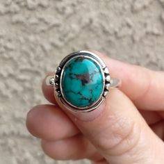 Beautiful genuine turquoise ring set in sterling silver. Gemstone Name: Natural Turquoise Metal: 925 Sterling Silver Size: 9 Weight: 4.8 grams Quantity: 1 Piece Free shipping for orders in the US. Will ship through USPS First Class mail. Please allow 1-2 business days for processing. We are a local small business located just outside of Tucson, AZ. Please look at our shop on Etsy for more great jewelry finds. Bohemian Sterling Silver Turquoise Ring With Eco-friendly Gemstones, Sterling Silver Turquoise Ring, Perfect As A Gift, Sterling Silver Turquoise Gemstone Promise Ring, Spiritual Sterling Silver Turquoise Ring With Natural Stones, Spiritual Turquoise Ring With Natural Stones In Sterling Silver, Spiritual Turquoise Ring In Sterling Silver, Spiritual Sterling Silver Turquoise Gemstone Ring, Spiritual Sterling Silver Turquoise Ring, Southwestern Turquoise Oval Cabochon Ring As Gift