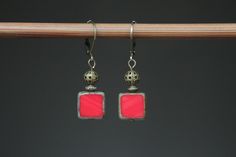 Red Earrings Dangle Drop Earrings Czech Glass Earrings Gift for women Gift for her Color : Opaque Red Picasso 10mm Square Beads Finish : Antique brass findings Size : Approx 1,5 inches including the antique Brass lever back Ear wires : Antique brass lever back Czech Glass Earrings : https://www.etsy.com/shop/NtikArtJewelry?ref=hdr_shop_menu&section_id=16062218 Thanks for looking Nickel-free Red Drop Earrings, Adjustable Red Elegant Earrings, Vintage Red Single Earring, Red Brass Earrings With Ear Wire, Red Brass Drop Earrings, Red Metal Dangle Earrings, Red Metal Earrings, Red Dangle Earrings With Lever Back Ear Wires, Red Metal Drop Earrings