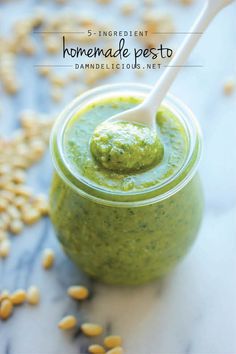 homemade pesto in a jar with a spoon