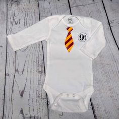 Harry Potter 9 3/4 Custom Made Baby Onesie. Wonder Nation Brand. One Of A Kind Custom Made Design. Long Sleeve. Multiple Sizes Available. Price Is For One Baby Onesie. Cute White Onesie With Character Print, Cotton Onesie With Character Print, Fitted Cotton Onesie With Character Print, Casual Fitted Birthday Onesie, White Fitted Onesie For Birthday, Casual Fitted Onesie For Birthday, White Long Sleeve Onesie For First Birthday, Fitted White Onesie With Character Print, White Fitted Onesie With Character Print