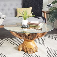 a glass table sitting on top of a white rug