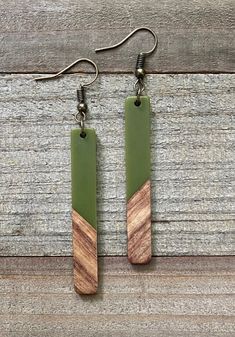 "Avocado Green & Wood Resin Bar Necklace & Earring Set. Simple, Minimalistic and totally Bohemian. Awesome as a gift for yourself of someone you love! Necklace Length: 19-21\" (I have a 2\" extender chain as shown in the pictures if you need extra length) Necklace Bar Pendant Length: 2\" Earring Pendant Length is the same: 2\" Necklace chain and earring hooks are antique bronze. Nickel & Lead Free. Hypoallergenic. Due to the differences in natural wood, some pieces may have more or l Fancy Date Night, Wood Resin Necklace, Necklace Minimalist Jewelry, Necklace Bar, Wood Resin Jewelry, 2 Necklace, Length Necklace, Green Wood, Bohemian Necklace