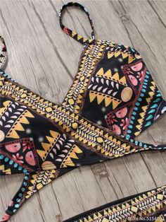 The Aztec Temptation Hollow Out Strappy Bandage Bikini is the perfect combination of fashion and style. This beautiful bikini is designed with a strappy bandage and a unique Aztec pattern. Its lightweight fabric and secure fit offer unparalleled comfort, making it an ideal choice for a fun day in the sun. modname=products&cols=5&colspace=10&rowspace=10&showName=true&showPrice=true 2018 Sexy Bandage Aztec Biquini String Strappy Swim Wear Bathing Suit Swimsuit Beachwear Swimwear Women Brazilian Bi Beachwear Swimwear With Wrap-around Straps, Summer Swimwear With Wrap-around Straps For Vacation, Strappy Beachwear Swimwear With Wrap-around Straps, Strappy Wrap-around Swimwear For Beachwear, Vacation Swimwear With Crisscross Straps And Triangle Top, Adjustable Strappy Black Swimwear, Black Adjustable Strappy Swimwear, Adjustable Black Strappy Swimwear, Beachwear Swimwear With Adjustable Spaghetti Straps