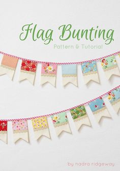 a bunting banner made out of fabric with flowers and flags hanging from the side