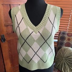 Pullover Sweater Vest, Sleeveless With V Neckline And Ribbed Hem Argyle Pattern 100% Acrylic Mint Green And Cream Color With Black Accent Lines Size Medium From Amazon Never Worn Pit To Pit Measurement: 17" Length: 18 1/2" Measurements Are Approximate Trendy Green V-neck Sweater Vest, Green V-neck Tank Top For Fall, Trendy Green Knit Sweater Vest, Trendy Green Cotton Sweater Vest, Casual Green Knit Vest, Trendy Cotton V-neck Sweater Vest, Casual Green V-neck Vest, Retro V-neck Spring Vest, Spring V-neck Retro Vest