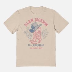 Everyone will know what you're listening to when you off your taste in country music with this officially licensed Alan Jackson All American Country Boy T Shirt! Suit up in this stylish tee and you'll always be repping your favorite artist. Officially licensed Crew neck Short sleeves Material: Cotton Care: Machine wash; tumble dry low Imported This tee is Unisex Sizing only For a fitted look, order one size smaller than your regular size Note: This style is print to order and may have a 1 to 2 d Retro T-shirt For Summer Country Concerts, Fall Letter Print T-shirt For Country Concerts, Graphic Print Crew Neck T-shirt For Country Concerts, Summer Graphic Print T-shirt For Country Events, Spring Americana T-shirt With Graphic Print, Spring Americana Style Graphic Print T-shirt, Spring Americana Graphic Print T-shirt, Western Style Relaxed Fit T-shirt With Screen Print, Western Style Cotton T-shirt For Country Concerts