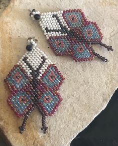 Sweet artisan made beaded butterfly earrings. The earrings have a 2-1/2 inch drop and are 1-3/8 inch wide. Bohemian Butterfly Shaped Beaded Jewelry, Bohemian Butterfly Beaded Jewelry, Handmade Multicolor Butterfly Earrings, Unique Handmade Butterfly Earrings, Handmade Butterfly Beaded Earrings For Gift, Beaded Butterfly Earrings, Earrings Native American, Beaded Butterfly, Native American Style