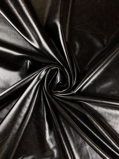 an image of a shiny black leather textured material that can be used as a background or wallpaper