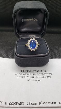 Tiffany & Co. Sapphire approx. 4.44cts and Diamond approx. 1.10cts cluster ring.  Retail replacement $31,000 from 1989. Ring is in excellent condition. Will come with replacement papers and Tiffany box. Tiffany Box, Cluster Ring, Tiffany & Co., Wedding Rings Engagement, Wedding Engagement, Diamond Ring, Jewelry Watches, Sapphire, Engagement Rings