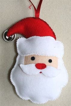 a santa claus ornament hanging on a wall