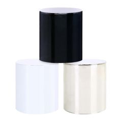 three rolls of black and white tape on a white background