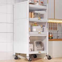 a white cabinet sitting on top of a hard wood floor