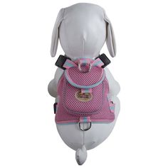 a white dog wearing a pink backpack with blue trims on it's back