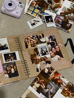 an open book with photos and pictures on the pages next to a polaroid camera