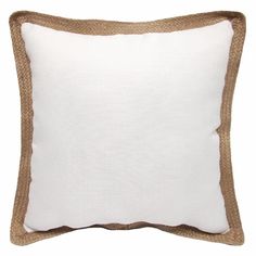 a white pillow with brown trim on the side and a tan border around the edge