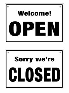 two black and white signs with the words open and sorry we're closed