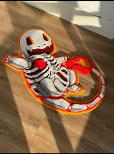 a rug with a skeleton holding a fire extinguisher on it's back