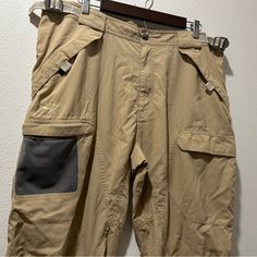 Men’s Light Khaki Colored Tactical Cargo Pants For Casual And Performance Wear. Double Pockets On Sides Of Each Leg (Outer Mesh Slip In Pocket With An Inner Zipper Closure Pocket, See Last Picture.) Velcro Pockets With Mesh Inner Lining On Each Thigh And On Each Side Of The Butt, 4 Total. Adjustable Waist And With Belt Loops. No Stretch. Size Xl Color Is A Light Khaki / Tan / Brown Condition Is New Without Tags / Like New, I Found Zero Flaws If You Need The Exact Measurements Of The Waist, The I Tactical Khaki Bottoms For Outdoor Activities, Khaki Cargo Pants With Pockets For Camping, Khaki Techwear Cargo Pants For Hiking, Techwear Khaki Cargo Pants For Hiking, Utility Cargo Pants For Camping, Tactical Khaki Cargo Pants For Outdoor Work, Tactical Parachute Pants For Outdoor Activities, Beige Cargo Pants For Outdoor Activities, Tactical Khaki Cargo Pants With Functional Pockets