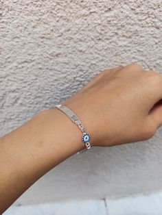 Color: silver Material: 925 solid silver Bracelet size: 16 cm 6 millimeter Evil eye size: 6 millimeter Name disk size : 2.8 cm 6mm note: If you want different size of bracelet, please contact me. 925 sterling solid silver bracelet has a very solid structure. I can engrave what you want on it. Evil eye detail on the side looks very elegant and beautiful. You will love this silver bracelet. https://www.etsy.com/shop/Hirajewelrydesign?ref=seller-platform-mcnav Silver Evil Eye Bangle Bracelet For Gift, Silver Evil Eye Bracelets In Sterling Silver, Silver Evil Eye Bangle Bracelet Gift, Sterling Silver Evil Eye Bracelets, Sterling Silver Evil Eye Bracelet In Silver, Silver Evil Eye Bracelet For Gift, Silver Name Bangle Bracelet, Personalized Blue Sterling Silver Bracelets, Minimalist Silver Evil Eye Bracelet