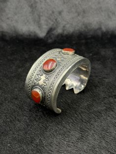 Beautiful Rare Vintage Handicraft Afghani Silver Bangle With Carnelian Stone From Afghanistan. Unique Bangle For Collection. Shipping Payment Feedback & Return Policy 1 : We ship Monday to Friday Via Airmail Register Insured  With Tracking # takes 2 to 4 Weeks to Destination. 2 : Contact us if you did not receive your item after 4 weeks. 3 : We Accept Payment From Most of the Mainstream Payment Methods. 4 : In Any Inconvenience Case we do Accept Return and full Refund. 5 : We Ship worldwide via Red Carnelian Bohemian Bracelets, Carnelian Bangle Bracelet Gift, Bohemian Red Carnelian Bracelets, Vintage Natural Stones Cuff Bangle, Vintage Natural Stones Cuff Bracelet, Vintage Bangle Cuff Bracelet With Natural Stones, Vintage Cuff Bracelet With Natural Stones, Vintage Carnelian Bracelets As Gift, Vintage Carnelian Bracelets Gift