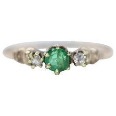 Vintage from the 1920s Size: 7 US Materials: Gold Gemstone: Emerald Band Color: Gold Style: Victorian Amazing Emerald set into a Victorian Claw with small cut diamonds on sides. Condition: Excellent condition for the age. Details: 3.5mm round emerald 2mm diamonds 0.8grams 10k gold Round Blue Sapphire Ring, Emerald Set, Emerald Band, 10k Gold Ring, Sapphire Solitaire, Victorian Rings, Ring Antique, Set Ring, Modern Ring