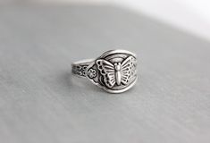 "Dainty butterfly spoon ring. Torch soldered. Sterling silver plated. This ring is adjustable and fits a size 4-10. Visit my shop today to see other great items. :) http://www.etsy.com/shop/WearitoutJewelz ♥I LOVE custom orders. :) I will gladly make any matching earrings, hair pins, necklaces, rings, bracelets, etc. to your preference. Just contact me via conversations. I can also adjust chain lengths or switch out earring hooks, free of charge. Just leave me a note with your preference in the Sterling Silver Rings With Butterfly Charm, Silver Butterfly Rings With Butterfly Charm, Adjustable Vintage Sterling Silver Butterfly Ring, Nickel-free Sterling Silver Butterfly Ring, Nickel-free Sterling Silver Butterfly Ring Gift, Spoon Rings, Pretty Gift, Dainty Ring, Chain Lengths