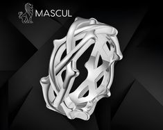 These striking thorn-shaped rings from Mascul embody a fierce Gothic aesthetic, perfect for those drawn to dark, edgy fashion.  Available in deep black, regal gold, and polished silver, each ring features a twisted design of interlocking thorns, evoking imagery of medieval crowns and ancient symbolism.  The black variant radiates a dark, mysterious allure, while the gold adds a bold, opulent edge, and the silver offers a sleek, metallic contrast.  Ideal for those with a taste for Gothic fashion, Medieval Crowns, Dark Edgy Fashion, Medieval Crown, Gothic Mode, Dark Mysterious, Gothic Aesthetic, Rose Ring, Perfect Gift For Her, Edgy Fashion