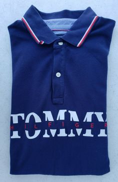 Brand: Tommy Hilfiger Type: Polo Shirt Size: Men's Large Fit: Custom Fit Closure: 1/4 Zip with Collar Sleeves: Short Sleeves Material: 100% Cotton Condition: Excellent Condition. Very lightly used. No rips, holes or stains. Please see all the pictures as they are part of the description.  Message me with any questions. Summer Cotton Polo Shirt With Logo Print, Collared Cotton T-shirt With Logo Print, Collared Cotton Shirt With Logo Print, Collared Cotton Shirt With Logo, Cotton Collared Shirt With Logo Print, Collared Tops With Logo Print For Summer, Summer Collared Tops With Logo Print, Summer Collared Top With Logo Print, Cotton Collared Top With Logo Print