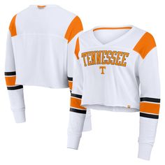 Channel your inner Volunteer with this Tennessee Volunteers Training Camp Cropped Long Sleeve V-Neck Fashion Top from Fanatics. This stylish top features contrast-color insets in the sleeves and a screen-print wordmark across the front for a spirited look. Plus, dropped shoulder seams and an unfinished cropped hem create a relaxed, flattering silhouette. V-neck Top With Contrast Stripes For Spring, Fall Sports V-neck Tops, Cotton Tops With Contrast Panels For Fall, Fall Cotton Tops With Contrast Panels, White V-neck Top For College, Sporty Contrast Color Tops For Fall, White V-neck Top With Contrast Stripes, V-neck Color Block Top For Layering, Collegiate Style Cotton V-neck Top