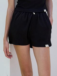 This is a modern and casual short pants by FACADE PATTERN that is made out of high quality and sturdy fabric. With unique design detail and trendy mood, you can style it for your clean and casual daily outfit.- Elastic waistband with adjustable string- Relaxed silhouette- Two pockets on the front Casual Black Bottoms With Drawstring, Modern Black Shorts With Built-in Liner, Black Bottoms With Functional Drawstring For Summer, Black Summer Bottoms With Functional Drawstring, Modern Black High-waisted Shorts, Versatile Black Bottoms With Functional Drawstring, Black Drawstring Bottoms For Everyday, Trendy High-waisted Shorts For Leisure, Black Leisure Bottoms With Built-in Shorts