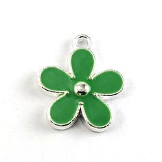 Green and silver colour flower charms that are silver alloy with Green enamel. They are the perfect focal point for your projects. You can use these on a chain, multiple strands of beading wire, leather cord, and more. Perfect for wine charms, bracelet, necklace, keychain, zipper pulls and other crafting projects. Made out of Alloy (Lead and Nickel free) and Enamel Silver / Green Colour Dimensions about 17x15 mm Quantity 10 pieces We sell crafting supplies in larger bulk quantities. If you want Necklace Keychain, Kids Christmas Ornaments, Green And Silver, Charms Bracelet, Dragon Pendant, Silver Colour, Beading Wire, Green Flower, Wine Charms