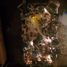 an aerial view of a living room and dining room area at night, from above