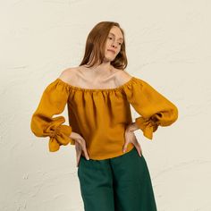 📏 FIT Jessica top is true to size, and has a regular fit. We suggest taking your usual size in this style to achieve the look as shown in pictures. Please note, the garment naturally softens and relaxes as you wear it throughout the day. It'll become more comfortable as you move around in it. 👉Model wears Spicy Yellow color. Model is 179cm/5'87" tall and wears a size S. Bust 83cm / 32.6"; Waist 67cm / 26.3"; Hips: 91cm / 35.8". ❤️ DESCRIPTION Jessica features an enticing off-shoulder design that showcases your shoulders, complemented by an elastic neckline and wrists for a snug fit. The long sleeves lend an air of sophistication, flowing gracefully. Crafted from luxurious linen, it feels soft against your skin and ensures comfort during intimate moments. Perfect for a candlelit dinner or Blouse With Ruffles, Linen Crop Top, Candlelit Dinner, Yellow Blouse, Summer Blouses, Boho Top, Linen Blouse, Top Vintage, Off Shoulder Tops