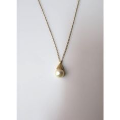 This is part of Chairish’s Fine Jewelry assortment.  A very beautiful white cultured pearl and 14-karat yellow gold necklace, circa mid-20th century. Pearl is very beautiful with a high luster. Pearl has a 14-karat yellow gold crown-like design attached to 14-karat yellow gold necklace. A beautiful piece to wear alone or stack with other necklaces. Very good condition as shown in images. No issues. Dimensions: pearl pendant is over 1/2" long x .25" Width. Necklace, from end to end, measures 19.2 Elegant Gold Round Pearl Necklace, Formal Vintage Akoya Pearl Necklace, Formal Yellow Gold Pearl Necklace, Classic Single Strand Pearl Necklace In 14k Gold, Refined Gold Pearl Necklace With Charm, Classic Pearl Necklace With Jewels For Anniversary, Vintage Akoya Pearl Necklace For Formal Occasions, Gold Akoya Pearl Necklace In Timeless Style, Timeless Pearl Chain Necklace For Formal Occasions