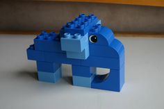 a blue lego horse is sitting on the table