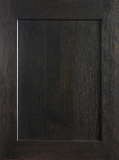 a close up view of a wooden frame with black woodgrain and white trim