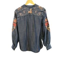 Chico's Women's Floral Embroidered Applique Bohemian Pin Tucked Blouse Size 6  Indulge in the artistry of Chico's with this embroidered floral denim blouse. The intricate floral patterns enhance its elegance and charm, offering a sophisticated yet casual look. * Buttoned cuffs  * Lightweight fabric  * Machine washable  Style: Floral, Embroidered, Applique, Bohemian, Pin Tucked Content: Lenzing Washing Instructions: Machine Wash Measurements: Armpit to armpit: 20" Back of Collar to Bottom Hem: 27" We ship most items out the next business day. Please contact us with any additional questions. We are happy to combine shipping when possible. Thank you! Features: * Floral, Embroidered, Applique, Bohemian, Pin Tucked Size: Womens 6 Condition: Pre-Owned Good Fall Floral Print Blouse With Multicolor Embroidery, Fall Blouse With Multicolor Floral Embroidery, Long Sleeve Bohemian Top With Floral Embroidery, Bohemian Long Sleeve Top With Floral Embroidery, Fall Festival Blouse With Floral Embroidery, Bohemian Blouse With Multicolor Embroidery For Fall, Traditional Long Sleeve Tops With Tonal Embroidery, Fall Festival Floral Embroidered Blouse, Long Sleeve Embroidered Bohemian Blouse