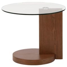 a table with a glass top and wooden base