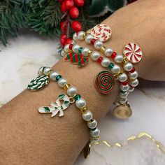 These cute Christmas candy cane theme stretchy bracelets are handcrafted personally for me, Derlis. There are three different styles for you to choose from: each bracelet has five assorted charms. You can get them as a set of 3 or individually. Also, you can choose your size bracelet. These bracelets are the perfect gift for friends, family members, wife, love ones, classmates during Christmas and New Year. Get the matching earring set: https://derlismatheusjewels.etsy.com/listing/1564988289 MAT Christmas Bead Bracelets, Christmas Bracelets Beaded, Candy Cane Theme, Handmade Bracelets Tutorial, Outfit Ideas Christmas, Christmas Jewelry Diy, Bracelet Christmas, Outfit Christmas, Jewelry Accessories Ideas