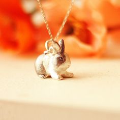 Discover the enchanting charm of our Handcrafted Sterling Silver Rabbit Pendant. Meticulously sculpted by expert artisans, this delightful bunny figurine captures the innocence and beauty of a rabbit in remarkable detail. Each pendant is crafted from pure 925 sterling silver, ensuring both durability and elegance, making it a timeless piece in any jewelry collection. This pendant is not just a beautiful accessory but a celebration of skilled craftsmanship. Every single hair and feature of the ra Rabbit Colors, Rabbit Pendant, Bunny Figurine, Leather Carving, Pet Urns, Memorial Jewelry, Pet Memorial, Animal Lovers, Eye Black