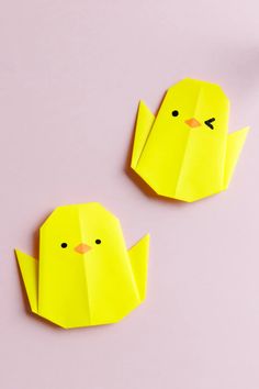 two yellow origami birds sitting next to each other