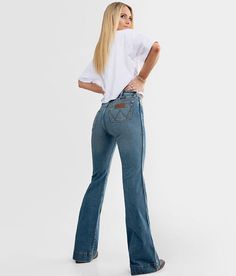 Wrangler® Retro® Trouser Stretch Jean - Blue 29/32, Women's Shelby High rise Slim through the hip and thigh 20 bottom opening Destructed pocket and hem detail Due to the unique wash process there will be a color varaince with each piece Shoe sku 952102 Model Info: Height: 5'6 | Bust: 33 | Waist: 27 | Hip: 36 | Wearing Size: 25x34. This quality denim is hand-finished for a unique look. It will wear like your favorite jeans, with each hole and tear continuing to destruct over time. You will love t Jeans Ads, Wrangler Jeans Women's, Clothes Country, Mom Fits, Retro Trousers, 2022 Outfits, Western Fits, Western Wear Outfits, Cute Country Outfits