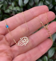 Very delicate and special ! The evil eye and Hand of Fatima is there for you to keep the negative energies away! ✨✨ P R O D U C T * D E T A I L S 14K Gold vermeil 925 Sterling Silver Size - 15.8 inches (~ 40 cm) 1.2 inches extension This necklace arrives in a charming gift package wrapped with love ❤️ . . . . . . . . . . . . . . . . . . . . . . . . . . . . . . . . . . . . . . . . . . ★ You can check out other lovely choices of jewelry in store Belita Design: https://www.etsy.com/shop/BelitaShop Dainty Evil Eye Jewelry For Good Luck, 14k Gold Evil Eye Jewelry Gift, Gold Evil Eye Jewelry For Blessing, 14k Gold Evil Eye Charm Necklace As Gift, Evil Eye Necklace Silver, Evil Eye Amulet, Rose Gold Choker, Gold Snake Chain, Hand Of Fatima