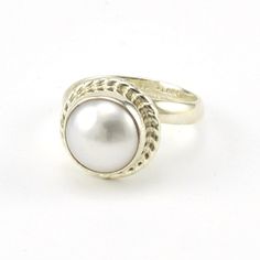 This 11mm genuine pearl is set in a sterling silver bezel setting with rope design. Designed by Charles Albert and crafted in Mexico, round setting is 9/16 inch wide and sits on a wide spiral band that can be adjusted. Style Number: 16195 Metal: 925 Sterling Silver Gemstone: Genuine Pearl Dimensions: 9/16 inch wide Handmade in Mexico Adjustable Pearl Ring For Formal Occasions, Adjustable Formal Pearl Ring, Classic Adjustable Oval Pearl Ring, Art Glass Jewelry, Rope Ring, Rope Rings, Rope Design, Amber Jewelry, Sea Glass Jewelry