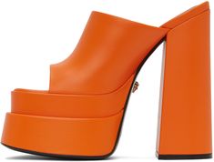 Buffed calfskin heeled sandals in orange. · Open square toe · Logo-embossed goatskin footbed · Covered block heel with rubber injection · Covered platform midsole · Signature Medusa hardware at calfskin outsole · Platform: H2.5 in · Heel: H6 in Supplier color: Orange Modern Orange Heels With Padded Heel, Luxury Orange Heels For Spring, Orange Open Heel Heels With Sculpted Heel, Modern Orange Open Heel Heels, Orange Block Heels With Padded Heel, Orange Leather Sandals With Padded Heel, Designer Open Heel Orange Heels, Orange Platform Sandals For Evening, Orange Square Toe Evening Heels