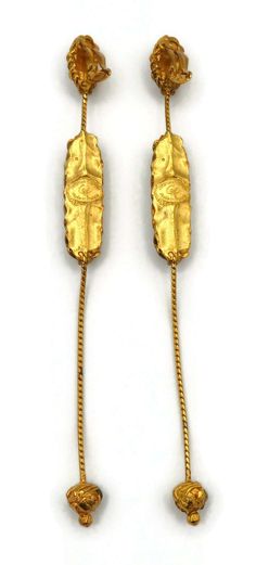 For Sale on 1stDibs - CHRISTIAN LACROIX vintage gold tone extra long dangling earrings (clip-on) embellished with an oval glass cabochon and enamel. Marked CHRISTIAN LACROIX Vintage Gold Long Drop Earrings, Gold Oblong Earrings For Formal Occasions, Christian Lacroix, Dangling Earrings, Extra Long, Vintage Gold, Gold Tones, Dangle Earrings, Glass